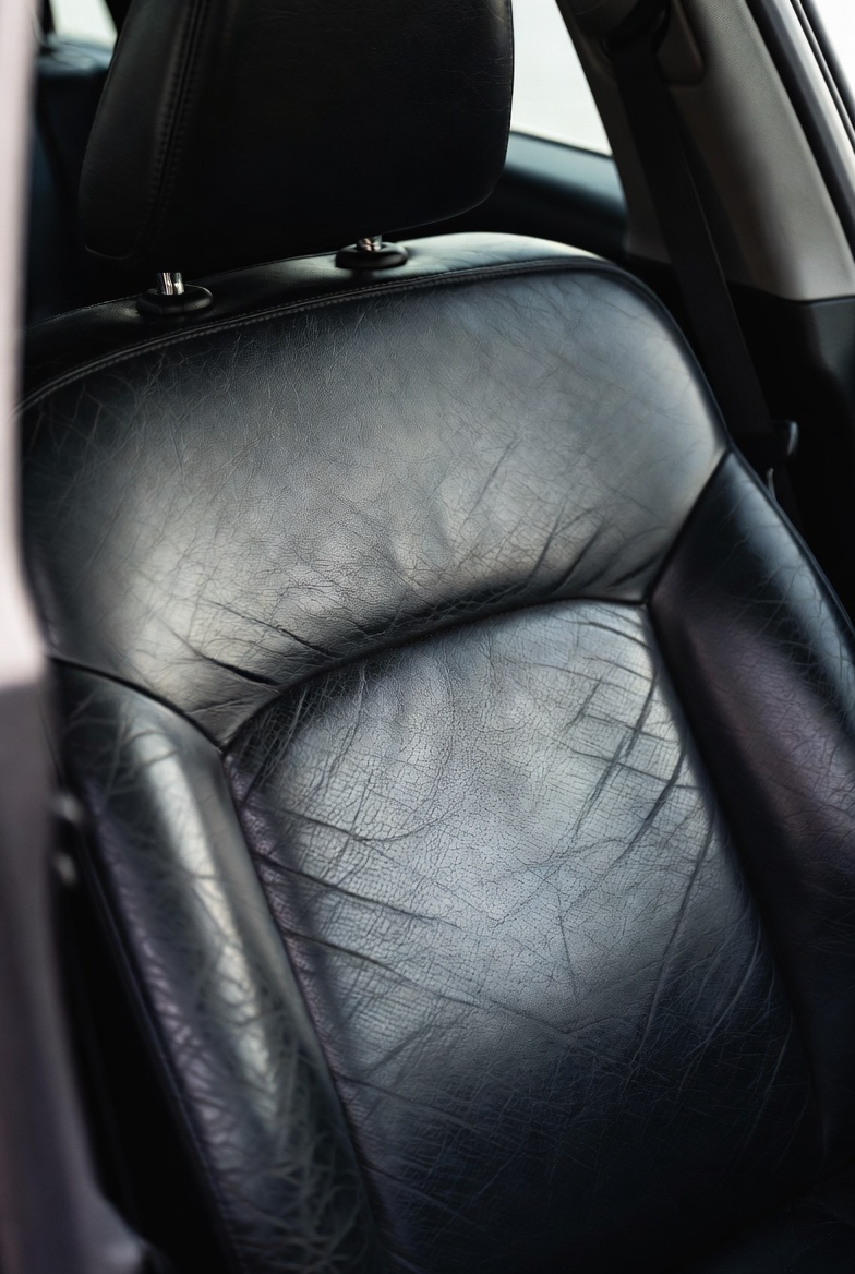 Leather car seat before restoration
